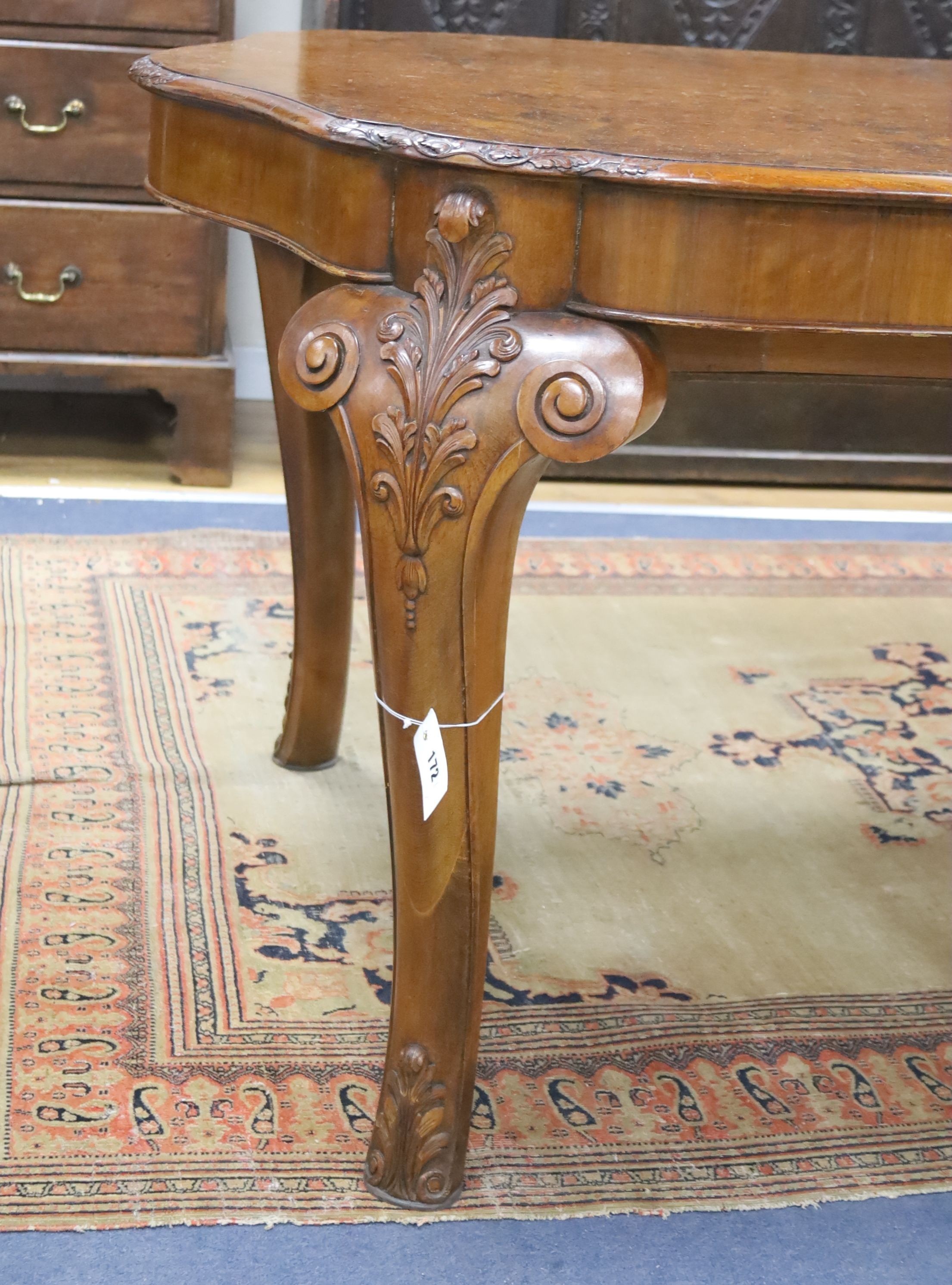 A Queen Anne revival burr walnut shaped oval extending dining table, 272cm extended, one spare leaf, width 106cm, height 75cm